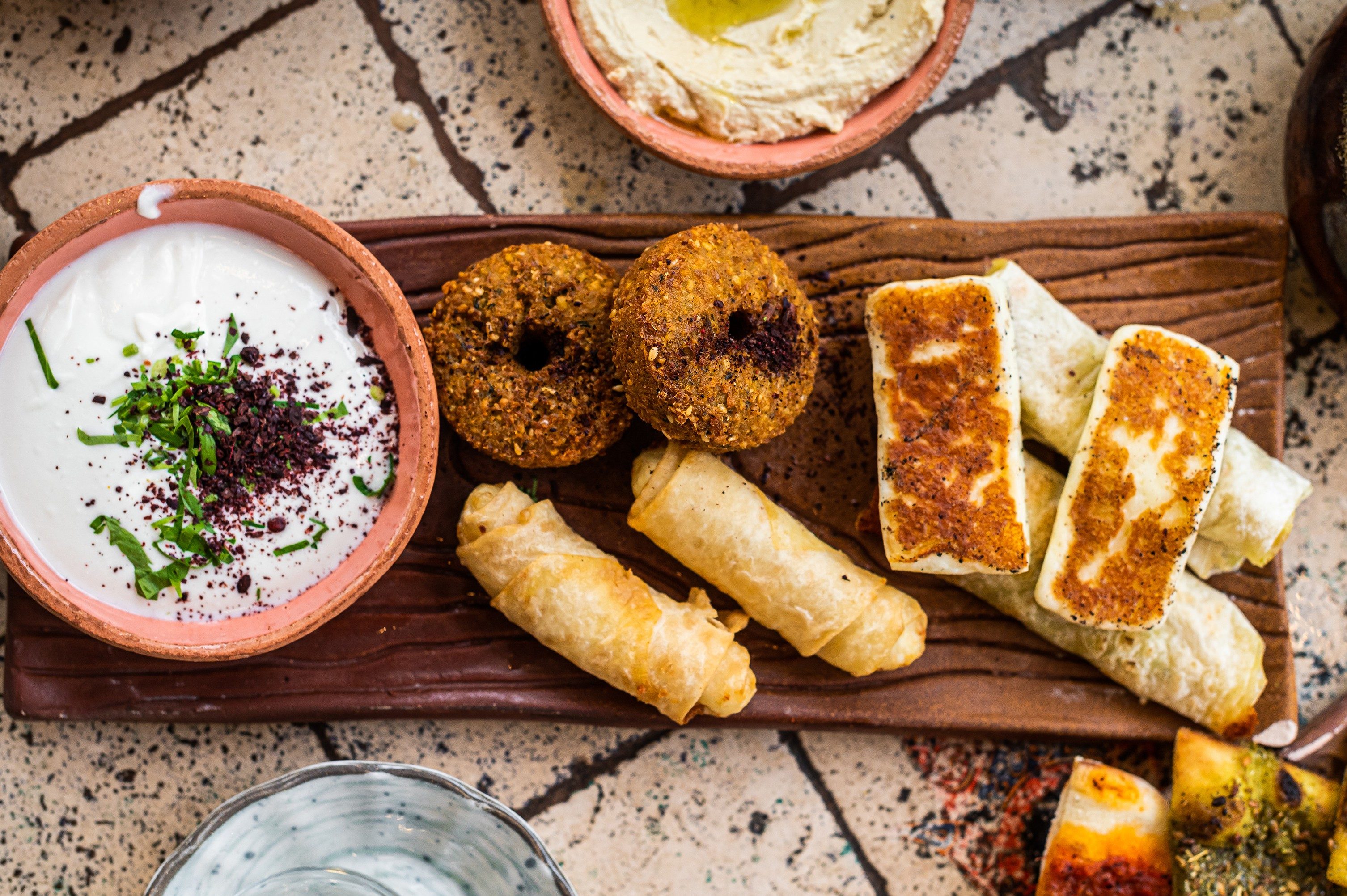 Fried cheese and falafel with sause in Turkish Village Breakfast. Top view.