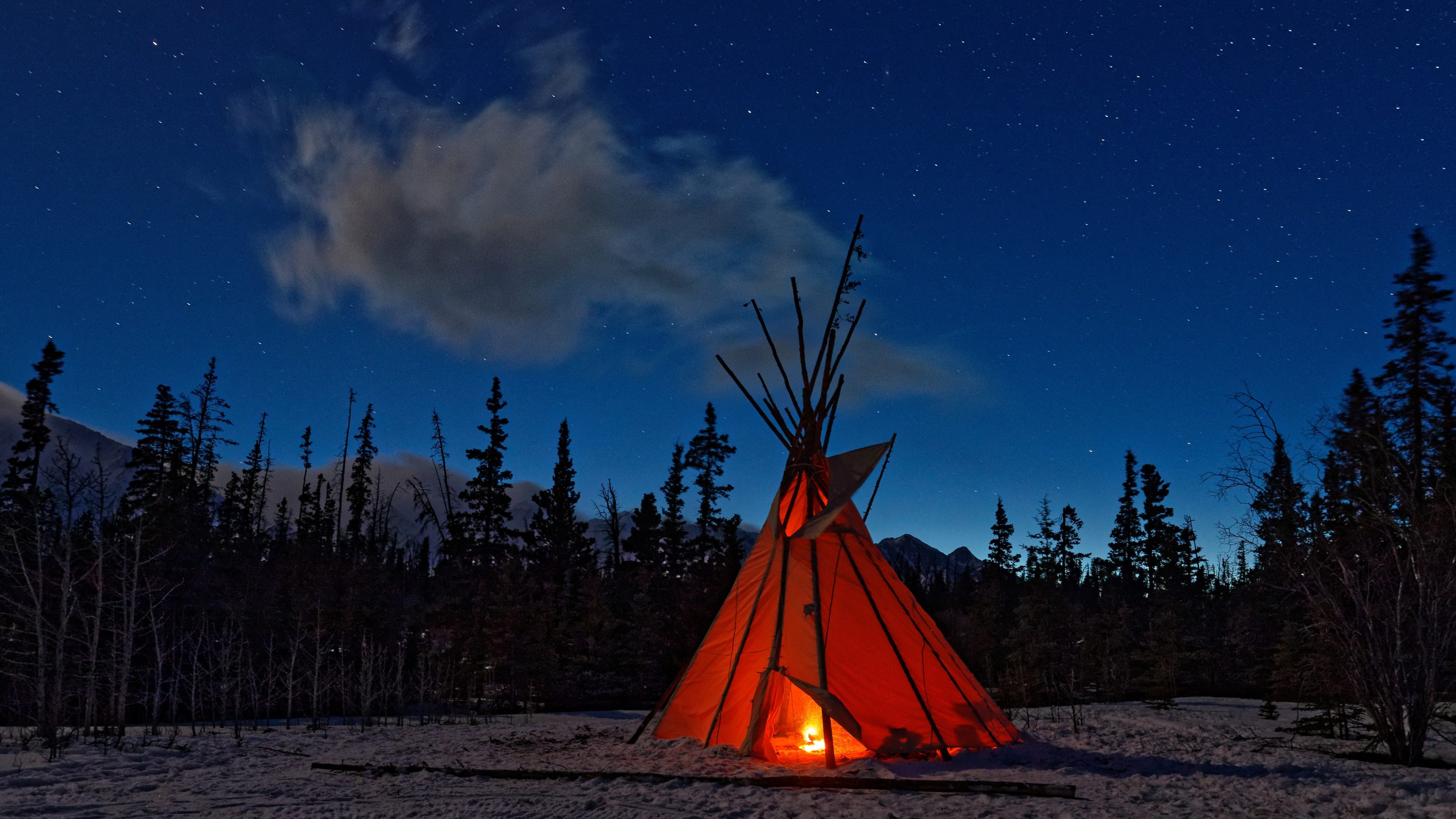 Teepee in the forest at night