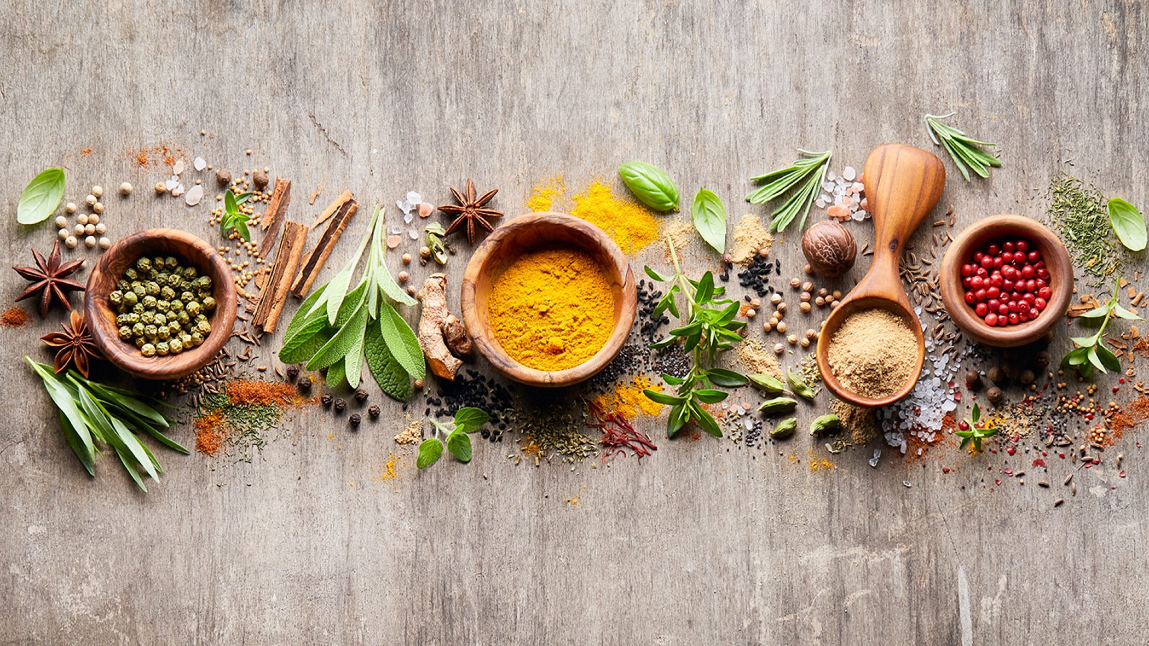 Herbs with spices on wooden board