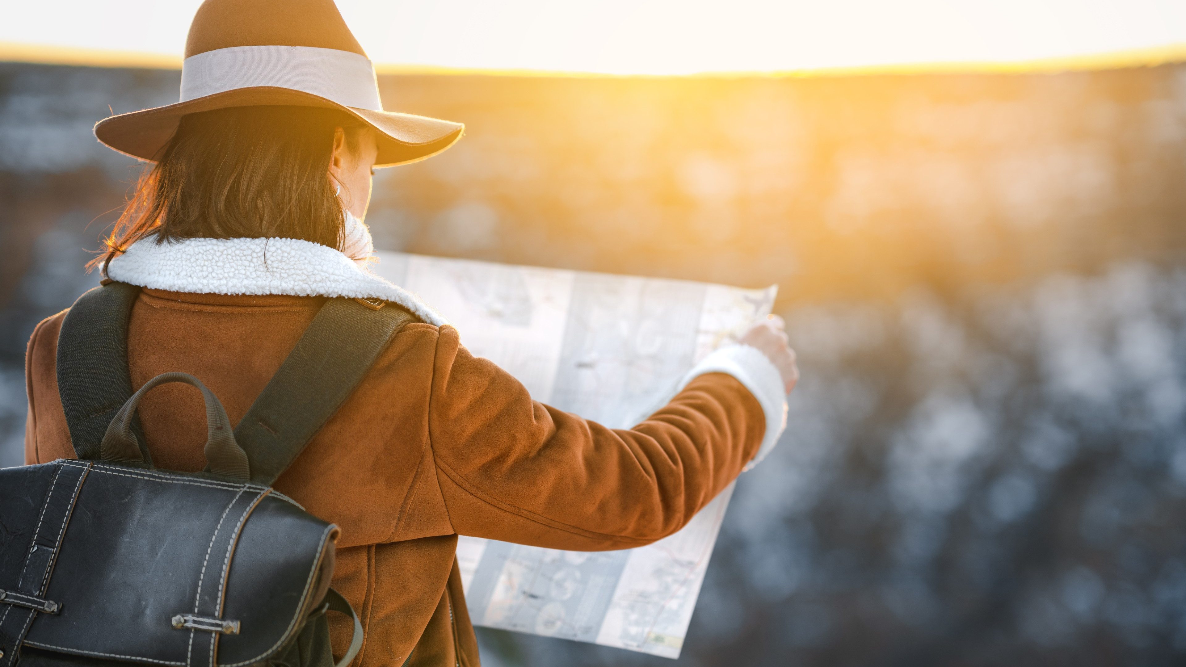 Young woman with a map in the National Park Grand Canyon