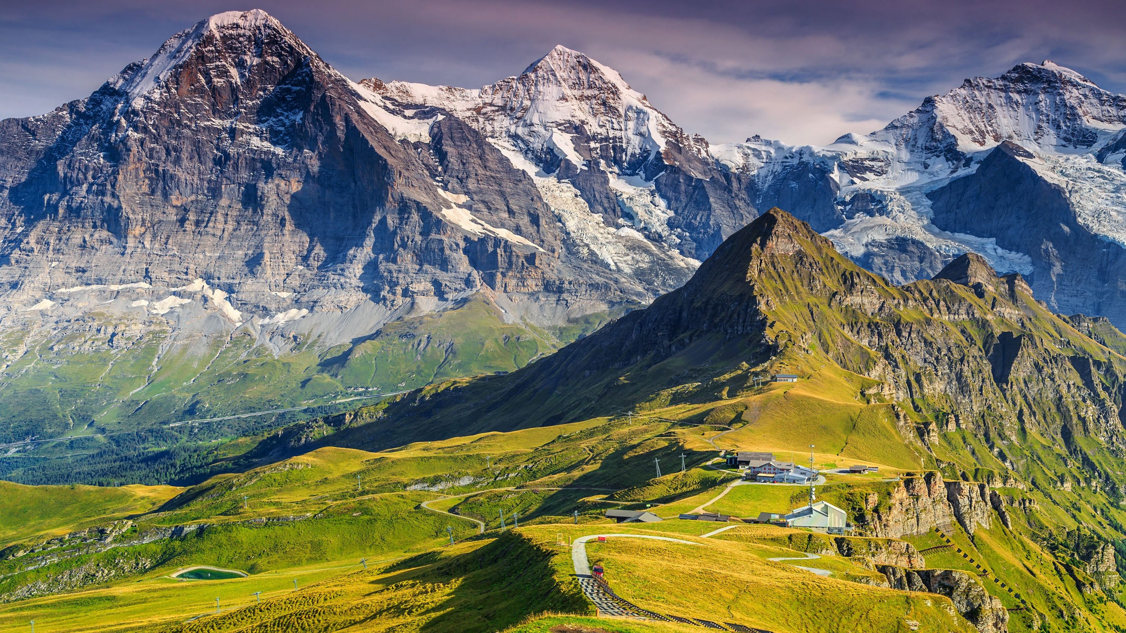 Stunning alpine panorama with Jungfrau,Monch,Eiger North face and Mannlichen cable car station,Grindelwald,Bernese Oberland,Switzerland,Europe