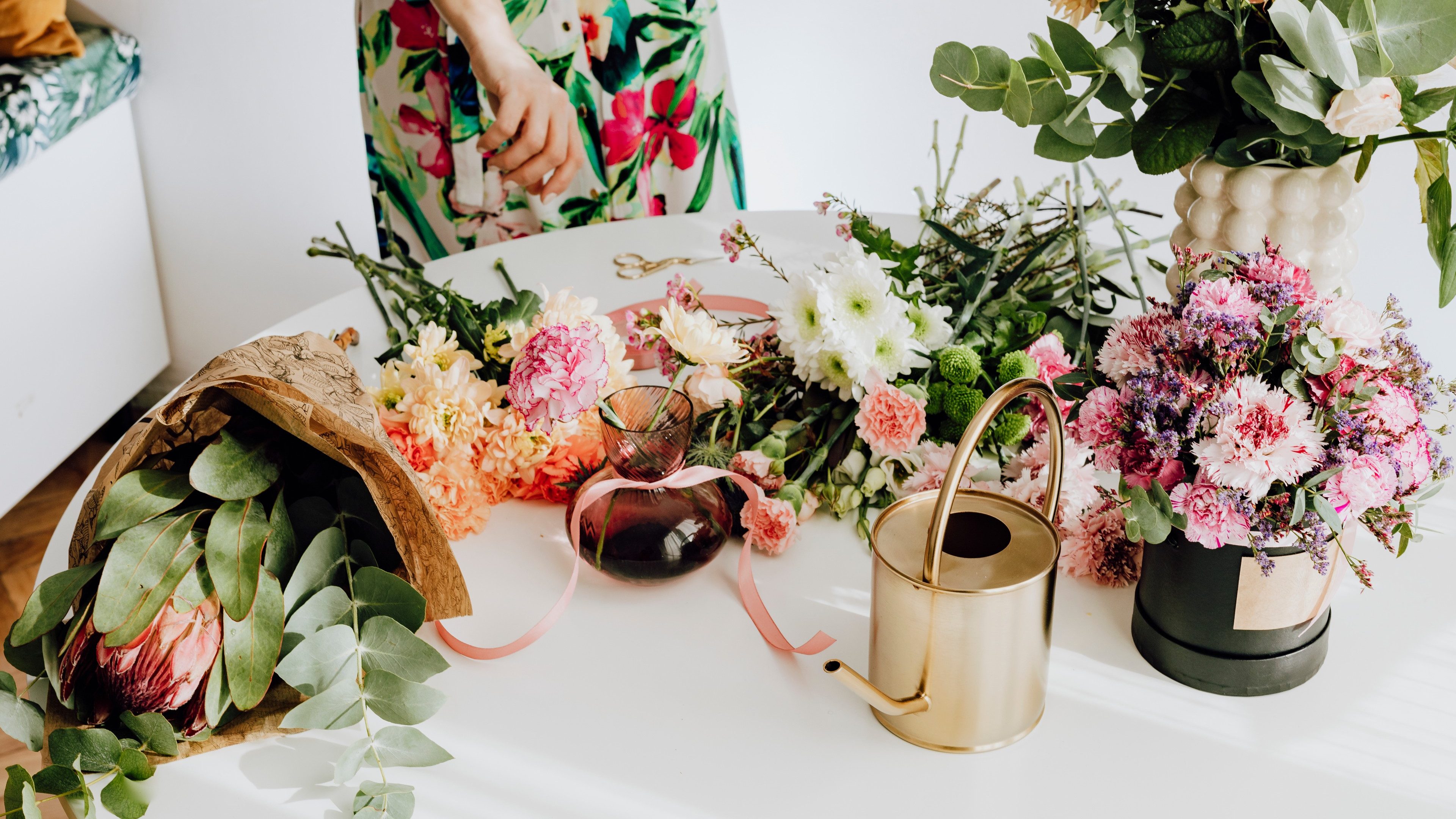 Florist arranging a bouquet of flower